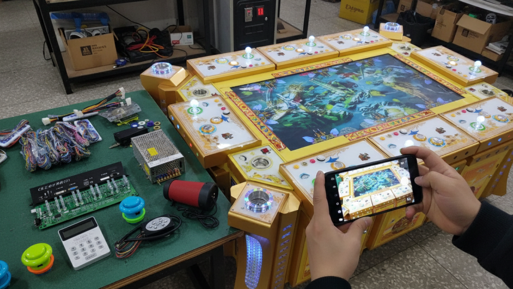 Fish game PCB connected with I/O board, power supply, and player wiring harness