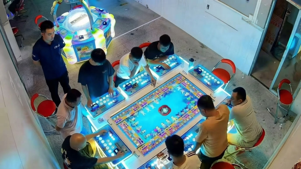 Technician checking 6-player and 8-player fish game cabinet layout, player spacing, and control panels