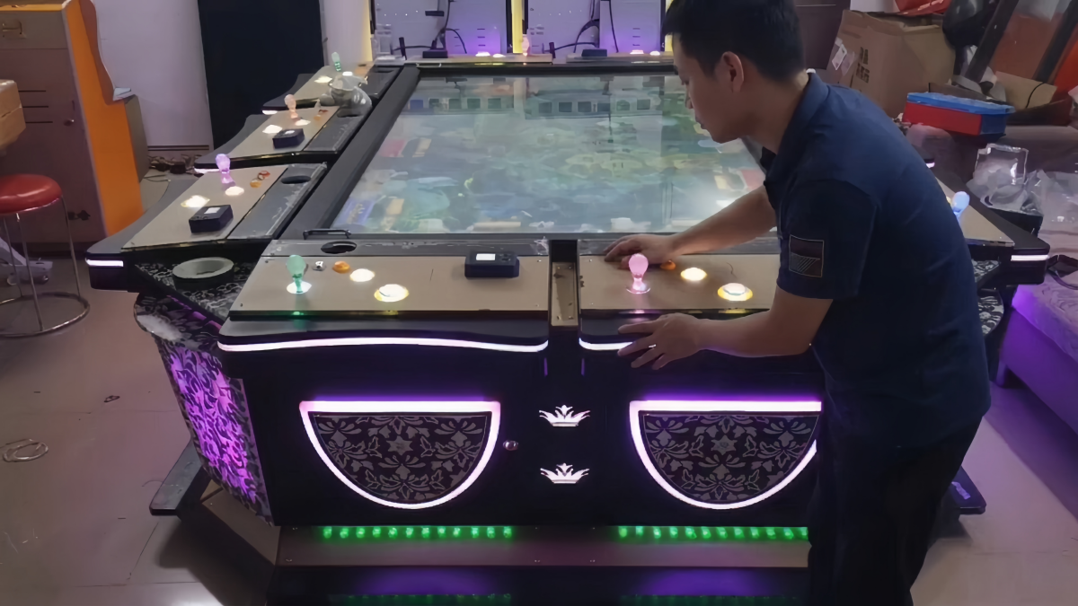 Technician inspecting an old fish game machine before PCB and system upgrade